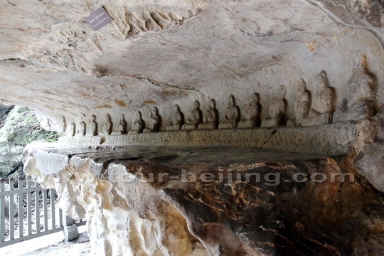 The carved 18 arhats above a huge rock bed