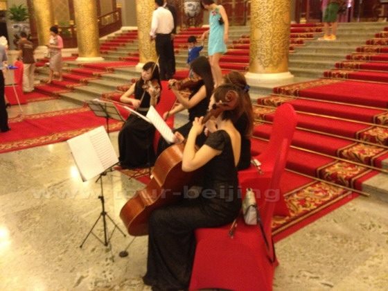 4 girls play string instruments welcoming 