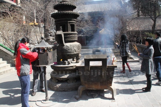 A big incense burner in front of the Vairochana Pavilion where people burn incense trying to talk to the buddha through the incense smoke.