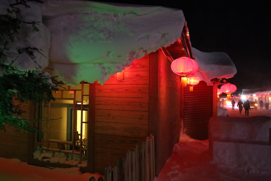 A heavy snow covered street front restaurant