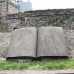 A huge stone opened book carved with words both in Chinese and English