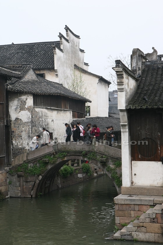 A humpback stone bridge over the canal linking two blocks of the traditional houses.