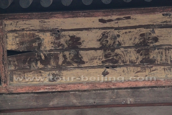 A plaque written with four bold Chinese characters hanging over the entrance to the Hall of Sakyamuni.