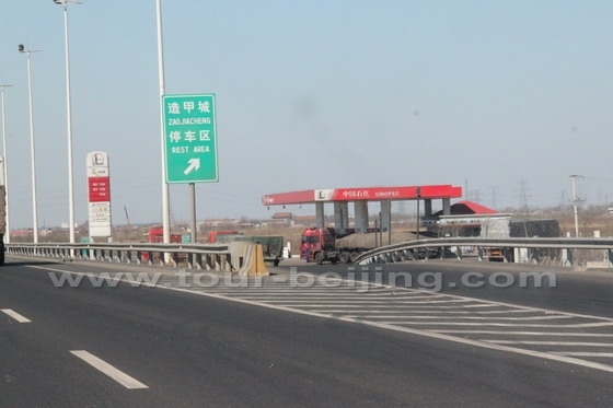 At the distance of 30km after the toll gate, we see the first service area