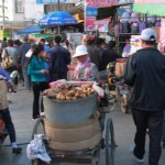 Baked potatos are sold in the Beijing east Road.