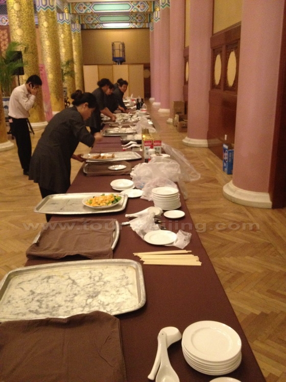 Caterers are busy serving the guests in the course of the civil ceremony.