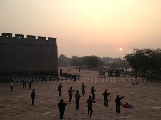 early risers doing morning excercises outside the Southern Gate of Pingyao Ancient City