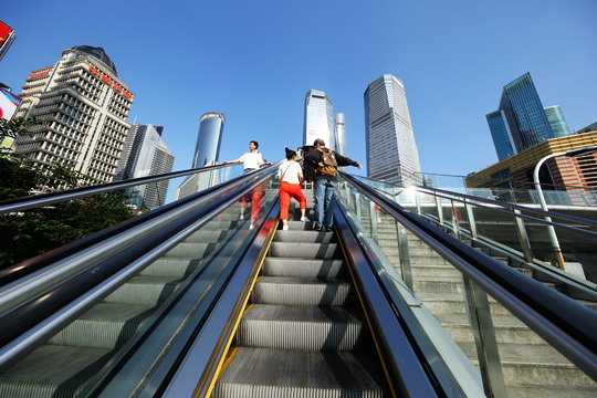 Take an escalator up to the ring road overpass.