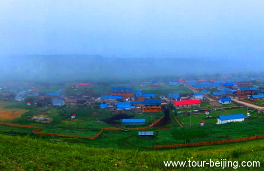 The fog-shrouded Linjiang Village in the early morning