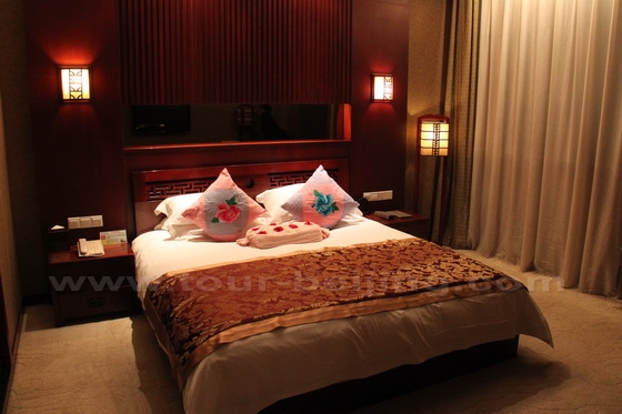 King-size bed room at Kylin Grand Hotel