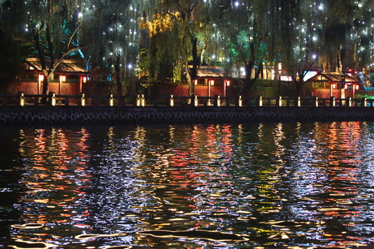 Lit-up sheds with amazing reflections on the water