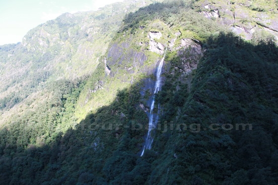 Plentiful waterfalls on the mountains along the road