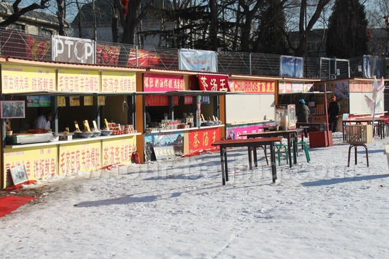 Several food vendors selling local snacks