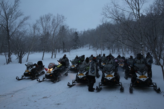 Snowmobiles are waiting for us.
