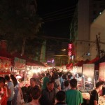 The diverse night stands fill up the narrow lane.