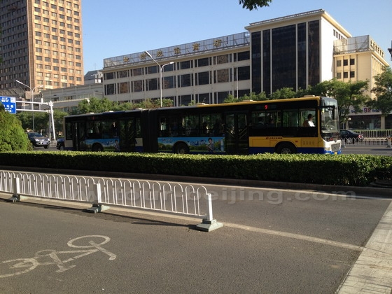 The longest public bus in China is moving on Chang'an Avenue, which is 18 meters long and can hold 180 passengers.