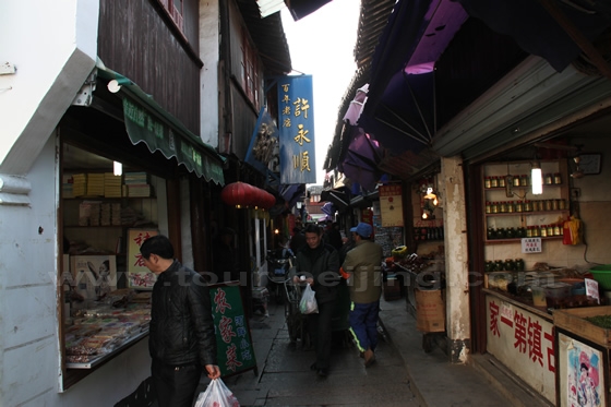 The narrow lane is rife with snack stalls and souvernir stores.
