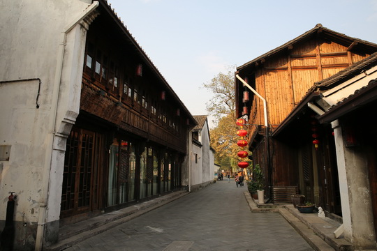 The street is lined with quite a few two-story old buildings