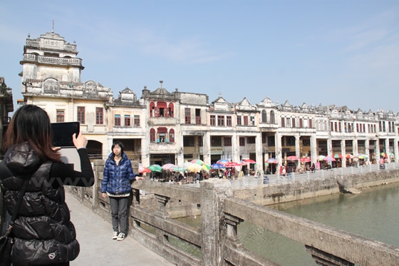 The streets are viewd from the bridge over Tanjiang River in the town