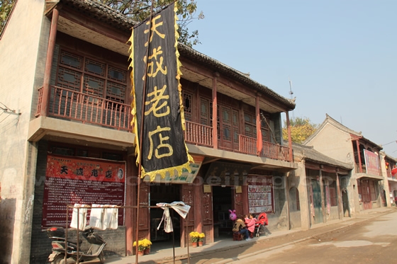 Tiancheng Nianhua Old Shop is housed in a two - storey buildings by the canal in Zhuxian Town