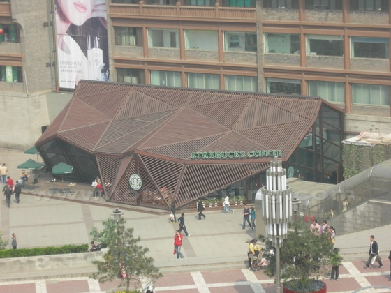 To the northwest of the Bell Tower, there is Starbucks Coffee