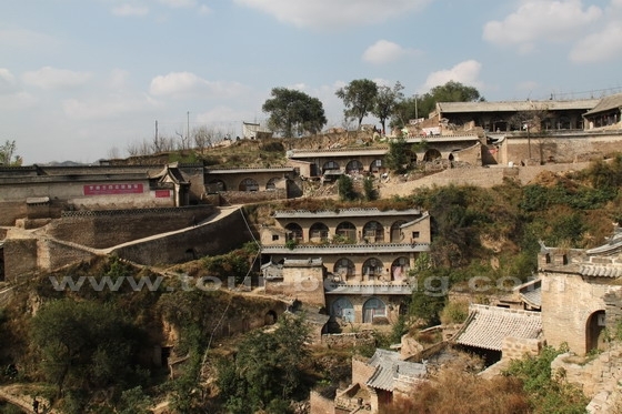 View the cave houses on the west side from the east side