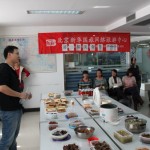 Wang Xiaolei is shily presenting his dish - Mapo Tofu with the helf of his wife.