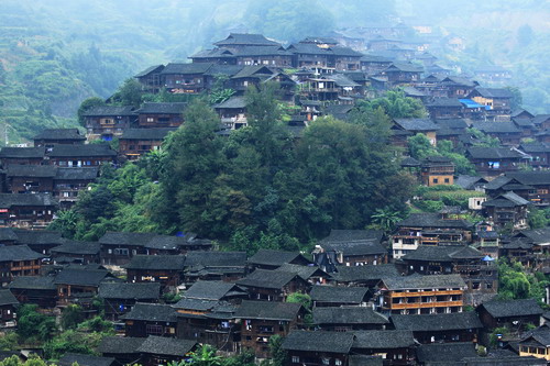 Have a close-up view of the stilt houses in Xijiang