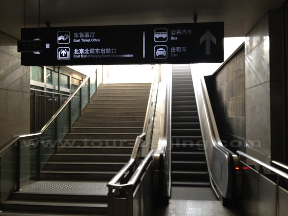 You have to take the escalator up to the ground