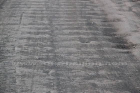 bumpy like a washing board with a corrugated surface