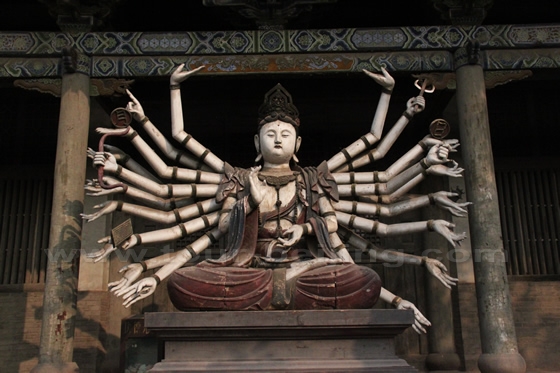 colored Bodhisattva decorated with several arms.