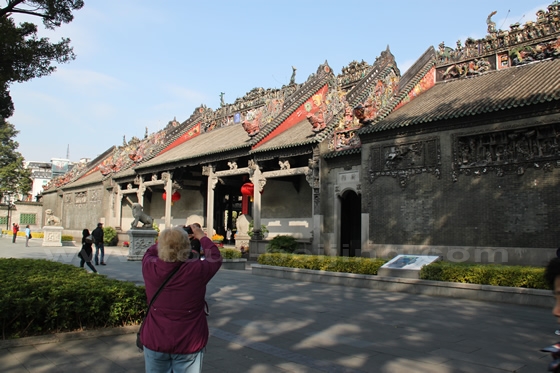 People are fascinated by the ornate carvings on the wall and roofs.
