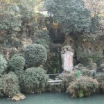 spring gushes out from the head of the yellow dragon and falls into the pond bebow