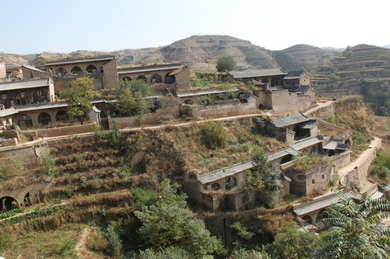 the cave houses hugging the hillsides on the east side.
