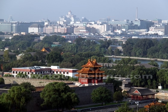 the massive Forbidden City looking brilliantly under a radiant rising sun.1