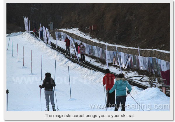 The magic ski carpet brings you to your ski trail.