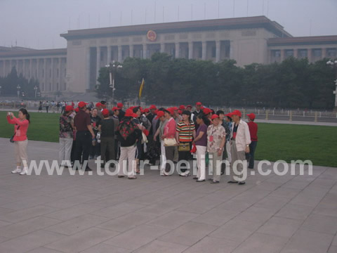A domestic tourist group with the background - Grand Hall of people