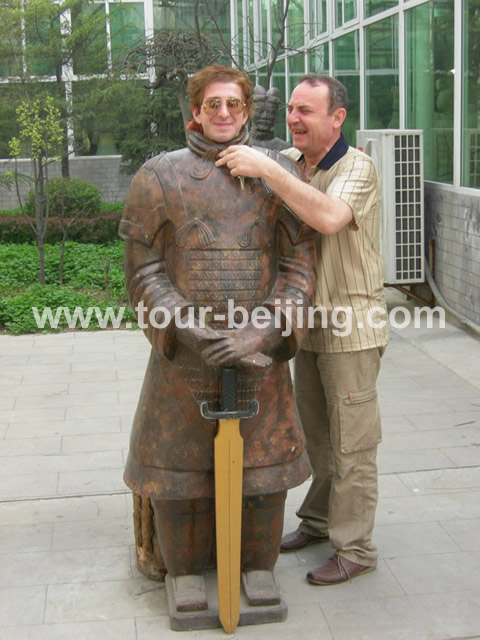 There is a terra-cotta army soldier moldel attracting lots of visitors for taking a picture