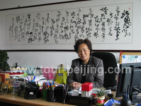 The founder of the sun village - Mrs Zhang Shuqin at her desk