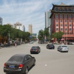 At a crossroad with Linxia Hotel at the front