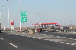 At the distance of 30km after the toll gate, we see the first service area