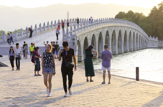 The sunset view of the 17-Arch Bridge over Kunming Lake in Summer Palace by yaqun_yang