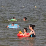 Kids are happy playing on the sea.