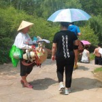 Local villagers are selling sun hats and fish baits