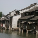 Many building protrude above the water