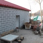 On the right side of the farmhouse, you are still able to see the wall submerged in water