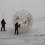 Play a transparent ball in the snow park.