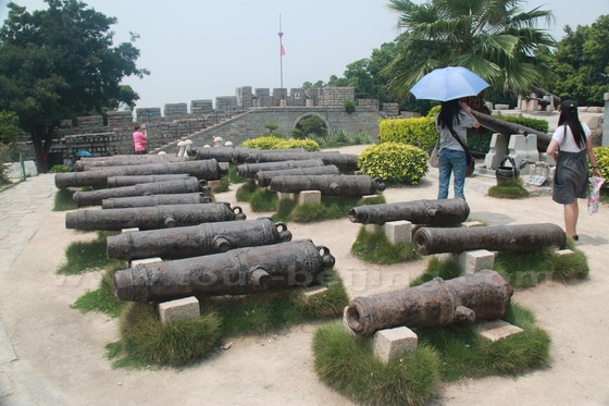 Some locally made iron cannons are on display.