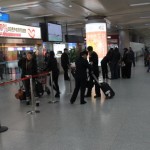 Take your checked luggage and have your luggage tag checked at the exit.