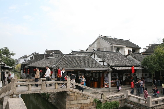 The beam bridge is across the river.
